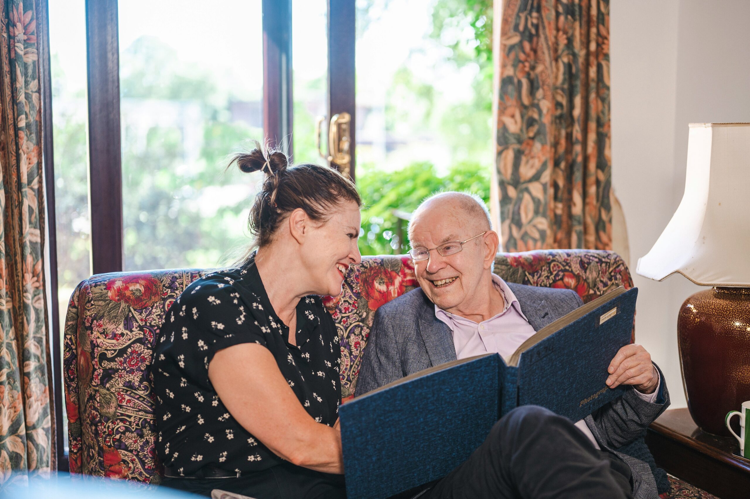 A family sharing a warm moment with a resident
