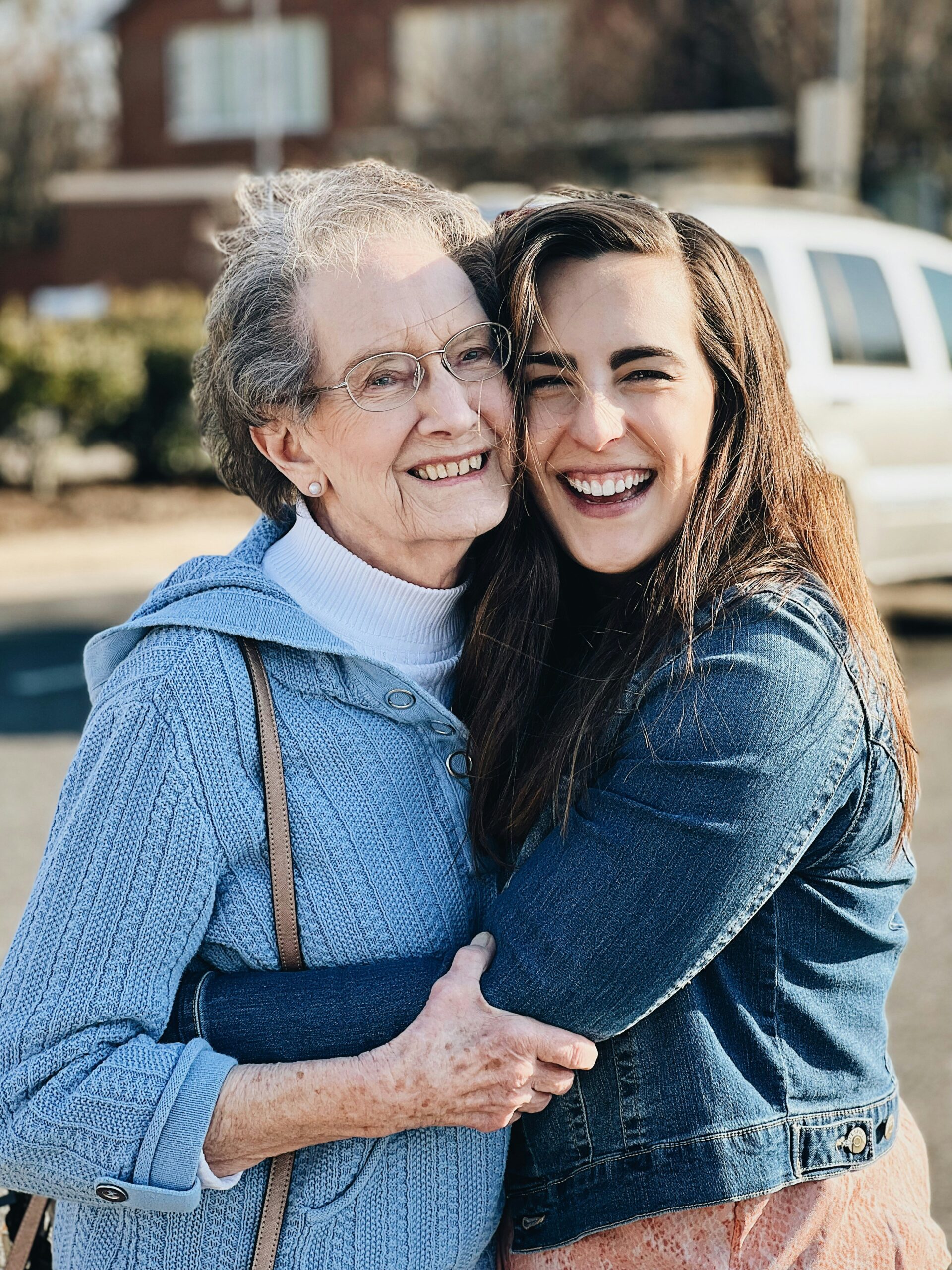 A family sharing a warm moment with a resident